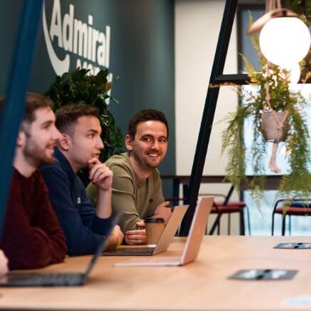 colleagues at a laptop